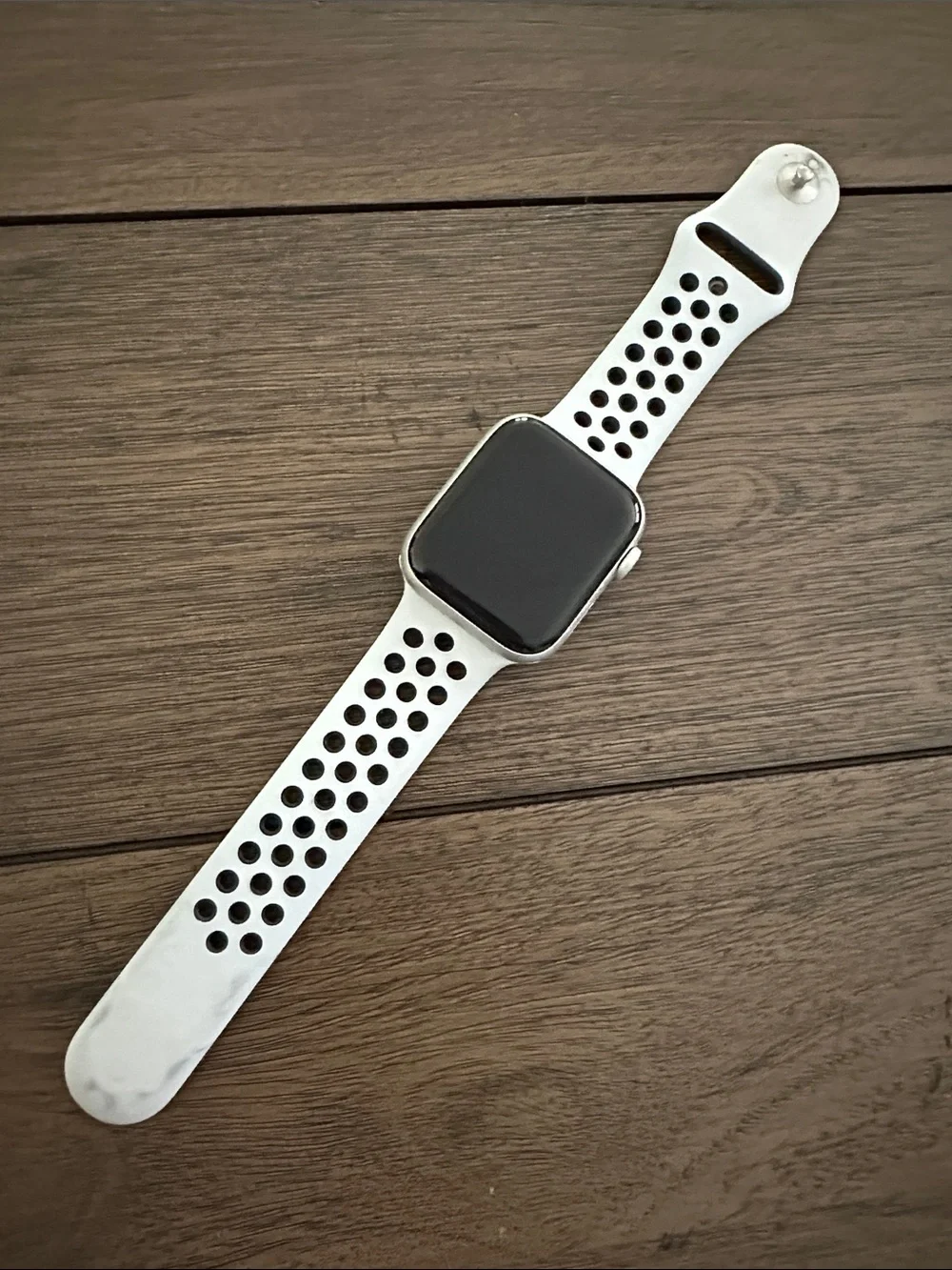 Apple Watch with White Perforated Sport Band. Nike addition series 5